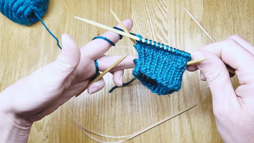 Step 11: Learn to switch from knitting in the magic loop to knitting in the round with double point needles (DPNs) - a lesson from Liz Chandler @PurlsAndPixels.