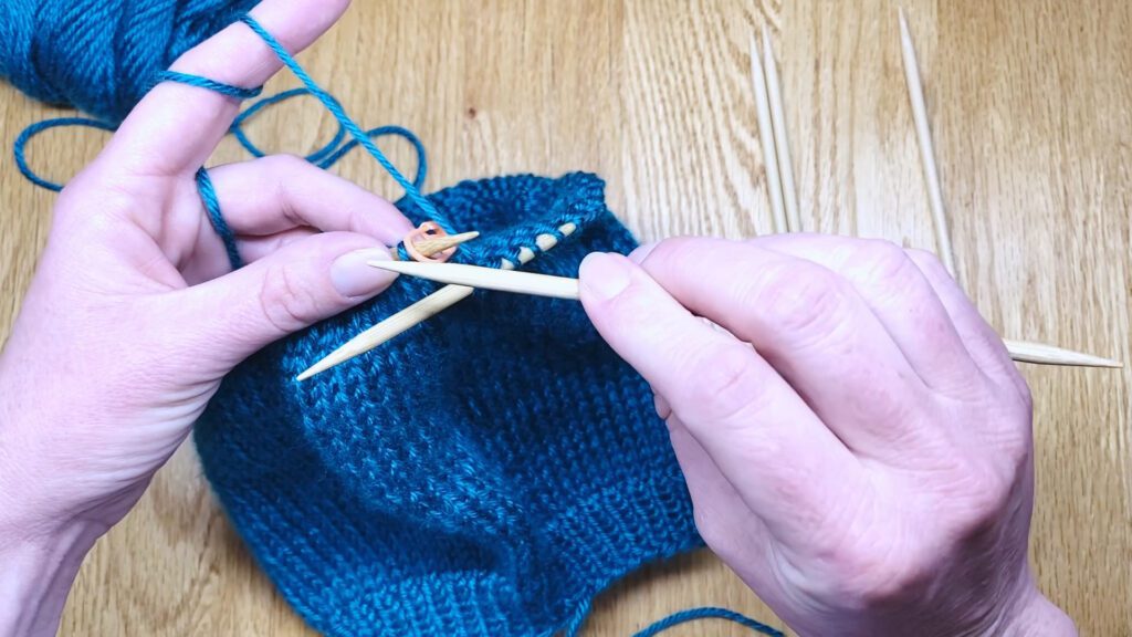 Step 2: Learn to switch from circular needles to double point needles (DPNs) by closing a bottom-up hat top in this knitting lesson with Liz Chandler @PurlsAndPixels.