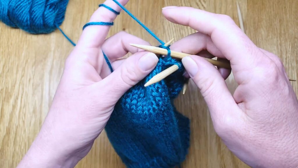 Step 5: Learn to switch from circular needles to double point needles (DPNs) by closing a bottom-up hat top in this knitting lesson with Liz Chandler @PurlsAndPixels.