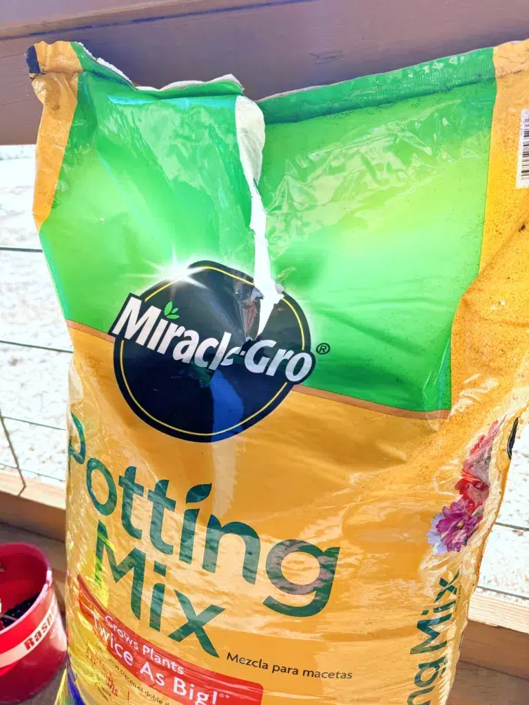 Open your potting soil with a vertical silt so you'll be able to close it more easily when you are done.