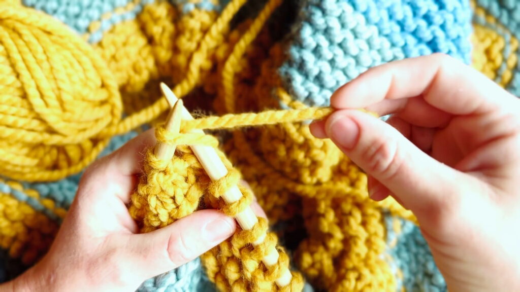 English-style knitting with the yarn held in the right hand and wrapped around the needle to form stitches.