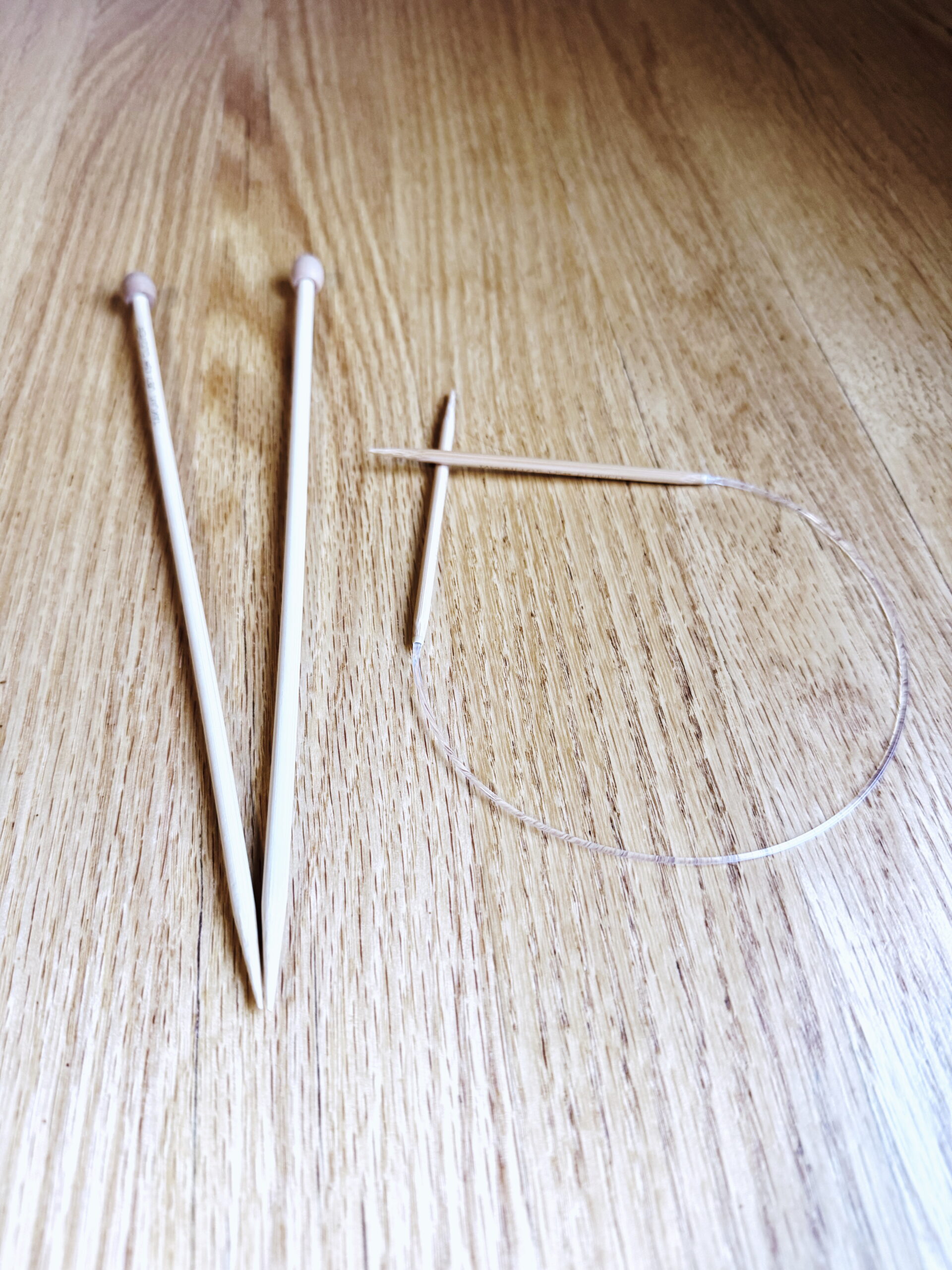 A pair of knitting needles. Are circular knitting needles one or two? Read more from Liz Chandler @PurlsAndPixels.