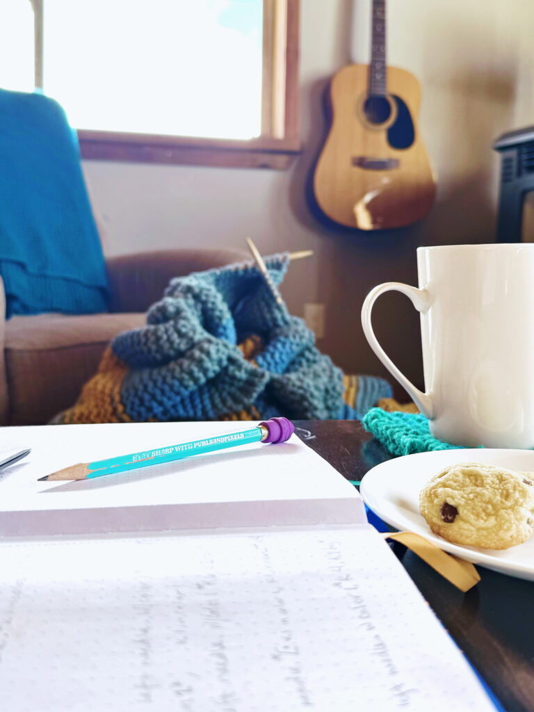 Knitting on the table, a hot mug, and a good cookie - the simple comforts that make handmade living feel grounding and doable. Cozy ideas, easy projects, and everyday self-reliance for real life.