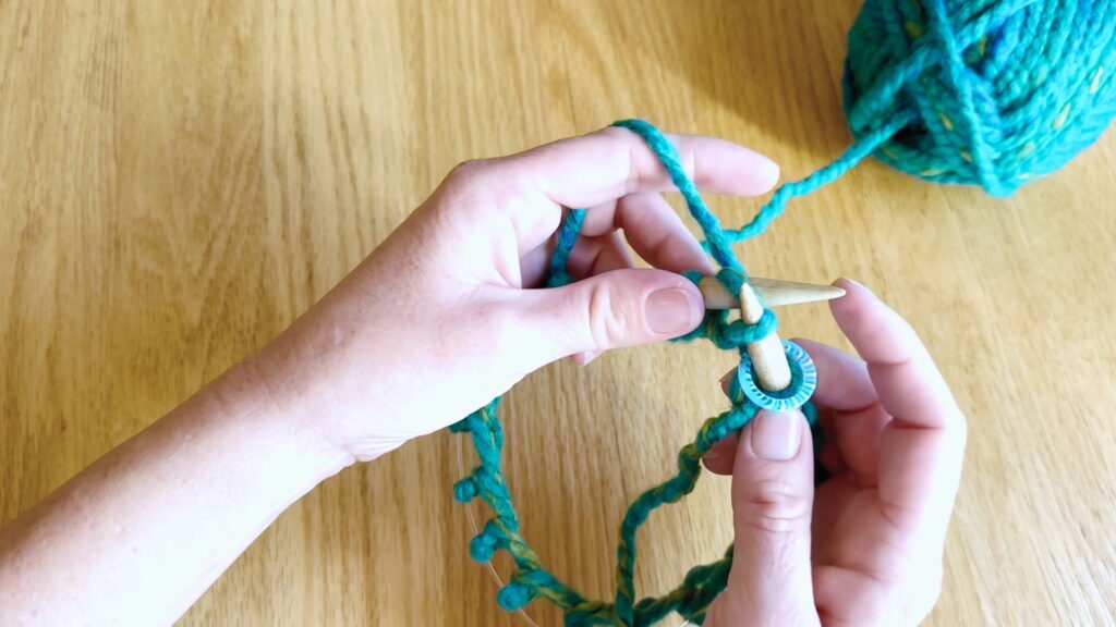 Lesson 8, Kids' Knitting Guide – knitting the first stitch to join the round and begin circular knitting.